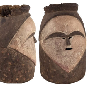 Fang Ngontang helmet mask from Gabon showing front and side view with white heart-shaped face