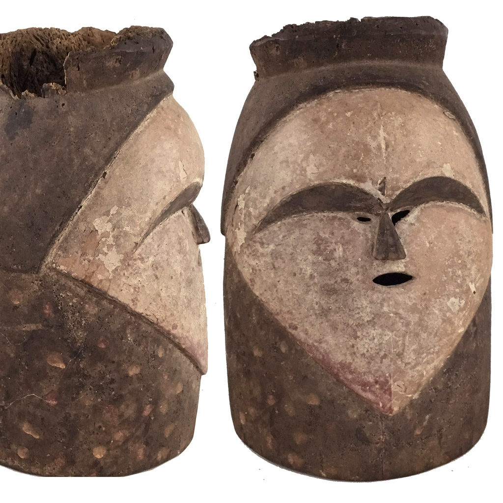 Fang Ngontang helmet mask from Gabon showing front and side view with white heart-shaped face