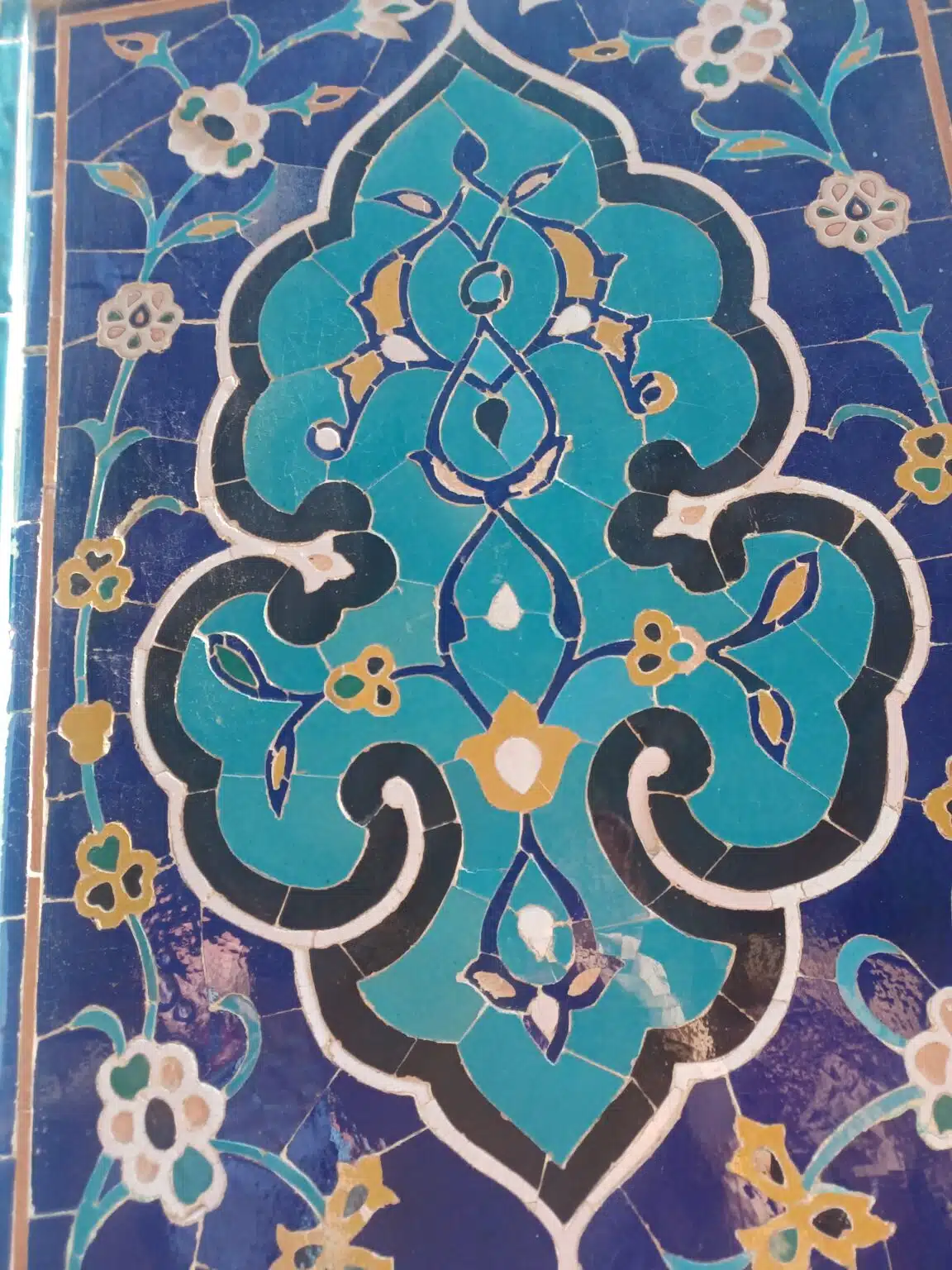 Metal warrior helmet and Kazakh bridal headpieces displayed together